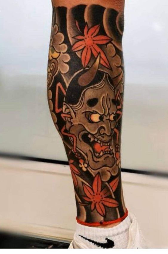 tattoo mặt quỷ nhật cổ bắp chân